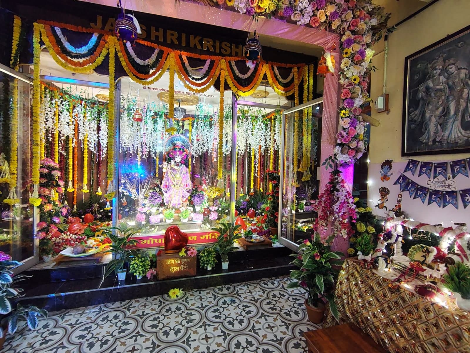 Shree Gopal Krishna Mandir decorated for an utsav beneath the Jai Shri Krishna sign